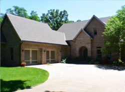 Luxury home with large driveway and two car garage.