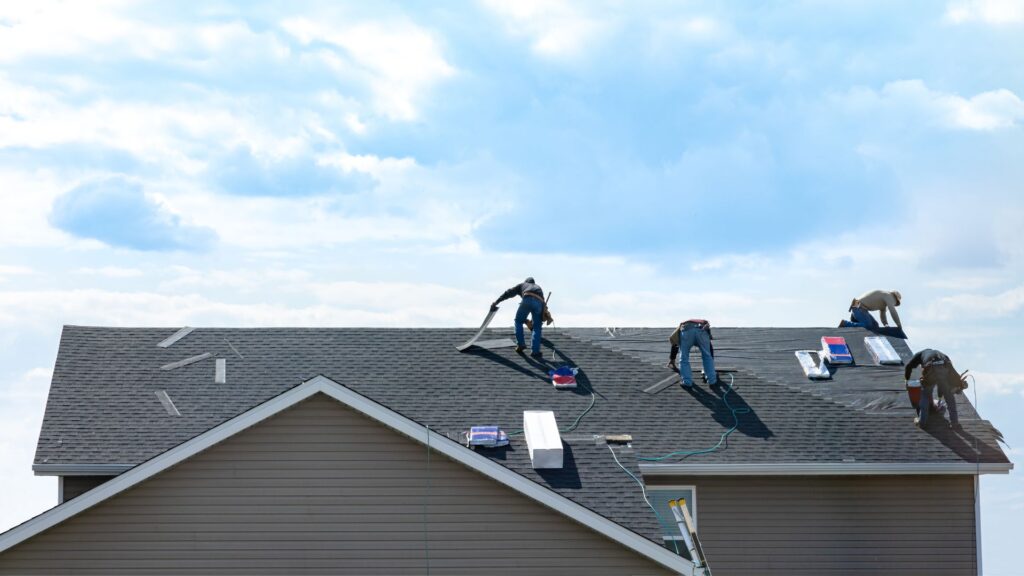 Qualified roofing contractor installing a foof.